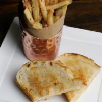 Kid'S Grilled Cheese · Sourdough bread grilled with cheddar and jack cheeses served with fresh-cut fries, fresh fru...