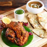 Tandoori Half Chicken · Half of a texas-grown whole chicken marinated overnight tandoor- roasted and served with but...
