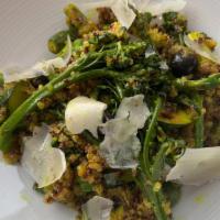 Quinoa Turmeric Salad · Sauteed tri color quinoa, asparagus, baby zucchini, blue berries, broccolini, kale, honey- g...