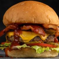 Double Bacon Cheeseburger · 2 Delicious homemade Beef patties served on a toasted bun with American cheese, crispy bacon...