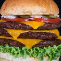 Triple Cheeseburger · 3 Delicious homemade Beef patties served on a toasted bun with 3 slices of American cheese, ...