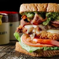 Bacon Chicken Sandwich · Delicious sandwich made with Fried chicken, crispy bacon, lettuce, pickles, tomatoes, srirac...