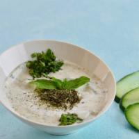 Tzatziki Dip · A cool and creamy Greek cucumber dill yogurt dip flavored with garlic. Served with fresh pita.