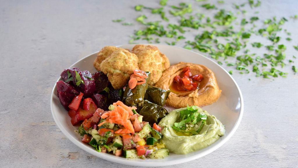 Veggie Sampler  · Your choice of one dip, two salads, two veggies and rice. All platter served with two pitas.
