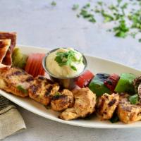 Chicken Kabob  · Marinated chicken breast, a blend of spices, paprika, onion, olive oil, yogurt parsley and t...