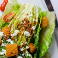 Grilled Romaine Salad · Grilled romaine hearts, thick bacon, candied pecans, grape tomatoes, feta cheese, cilantro a...