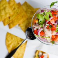 Cilantro-Lime Shrimp Salad · Seared jumbo shrimp, roasted corn and tomatillo relish, cotija cheese, tortilla strips, cila...