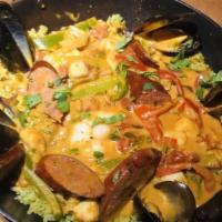 Southwest Paella · Jumbo shrimp, mussels, bay scallops, jalapeño texas sausage, roasted poblanos, lobster cream...