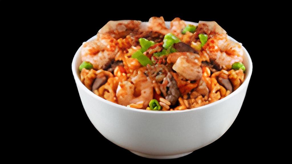 Combo Fried Rice · Chicken, beef, and shrimp wok tossed with fried rice. Available in spicy (as pictured) or regular.