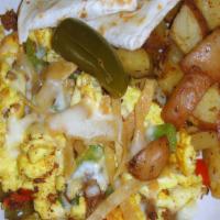 Migas · Homemade chorizo, onions, bell peppers, and sliced jalapeños, tossed with scrambled eggs and...