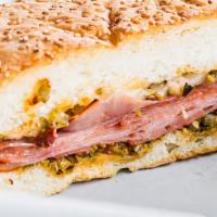 Piggy Boy Sandwich · Ham salad, ground ham, salami mixed with jalapeno juice served with mayonnaise, pickles, and...