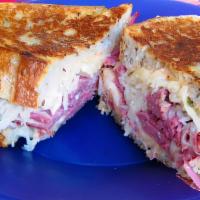 Corned Beef Sandwich · Thin sliced beef served with provolone cheese, mayonnaise, dill pickles, and special sauce c...