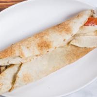 Chicken Shawarma Wrap · Marinated chicken breast cooked to your perfection served on pita bread with creamy garlic s...
