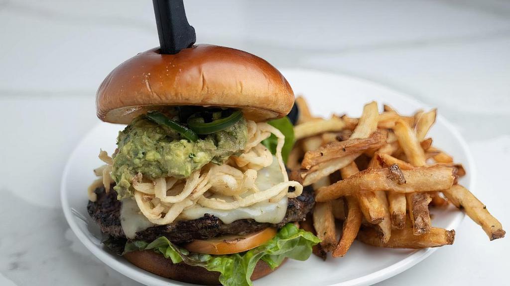 Jalapeno Pepperjack Burger · 1/2 lb. USDA choice lean ground beef patty prepared on a toasted pub bun spread with chipotle aioli. Served with melted pepper jack cheese,. sliced jalapeños, crispy fried Tabasco onion strings, guacamole, red leaf lettuce and sliced tomatoes.