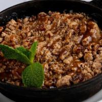 Whiskey Apple Crumble · Whiskey glazed Granny Smith apples, baked with a cinnamon-pecan. streusel topping with salte...