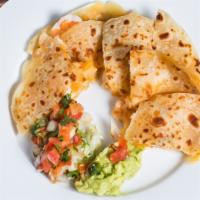 Quesadillas With Shrimp Ranchero · Handmade flour tortillas filled with melted cheese and, served with guacamole, sour cream an...