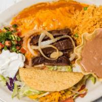 La Mason · One cheese enchilada, one crispy ground beef taco and a side of fajita meat.