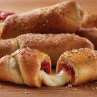 Pepperoni Twists (6) · Cal. 290/Twist. Twisted daily. Get'em and go! Fresh Italian dough wrapped around pepperoni a...