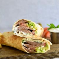 Gyro Sandwich  · Beef lamb gyro topped with pickles, onions tomatoes and tzatziki sauce. Served with your cho...