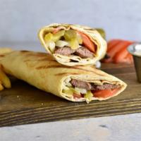 Steak Kabab Sandwich · Fine, tender steak grilled to perfection, served with pickles, tomatoes, onions and topped w...