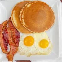 American Breakfast · Two pancakes, two eggs, choice of bacon, ham, or sausage