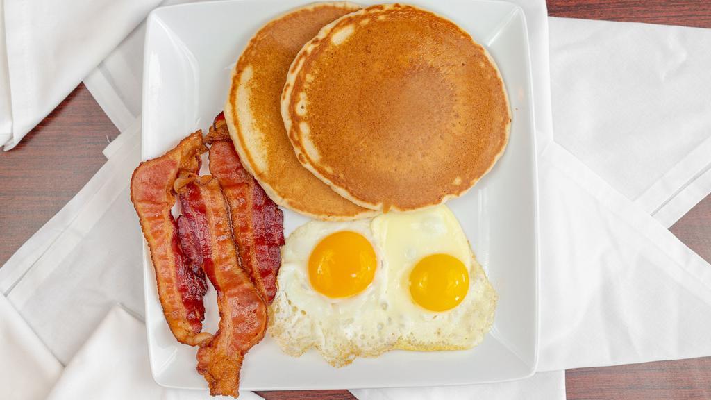 American Breakfast · Two pancakes, two eggs, choice of bacon, ham, or sausage