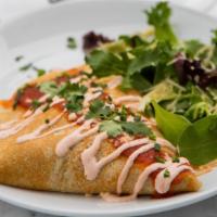 Chicken Enchilada · Grilled chicken, refried beans, topped with crema, queso fresco, cilantro, & chipotle sauce.