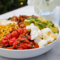 Cobb Salad · Spring mix, hard boiled eggs, basil infused cherry tomatoes, avocado, bacon, feta, corn sala...