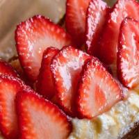 Strawberry Ricotta Toast · Strawberry, honey syrup, and ricotta powdered sugar.