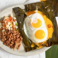 Cowboys Delight · 1 Famous tamale (chicken or pork) topped with our gravy, chile con queso and 2 eggs over eas...
