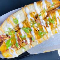 Loaded Dog · Loaded with French fries, cheddar cheese, bacon bits, sour cream and scallions