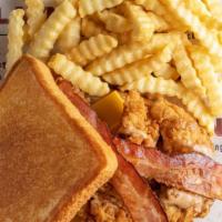 The Club Sandwich Meal Combo · Three chicken fingers on Texas toast with cheese, beef bacon and Layne's sauce crinkle cut f...