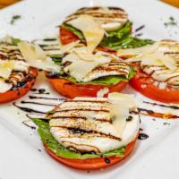 Caprese Salad · Buffalo mozzarella, tomatoes and basil olive oil balsamic.