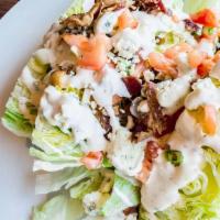 The Wedge · iceberg lettuce, bacon, tomato, green onion, blue cheese crumbles with house-made ranch