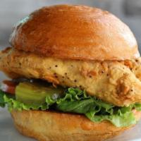 The Fried Chicken Sandwich · fried chicken breast or dipped in buffalo sauce served with ranch, lettuce, tomato and pickles