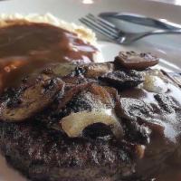 Chopped Steak · Black Angus ground beef with sautéed onions and mushrooms topped with brown gravy