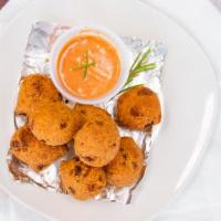 Jalapeño Hushpuppies (8) · Spicy. In-house made Jalapeno Hushpuppies