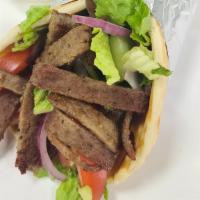 Gyro Sandwich · Beef gyro on pita bread with lettuce, tomatoes, onions , cucumbers and sauces