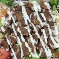 Gyro Over Salad · Beef Gyro served over salad (Greek or Garden) with sauces.