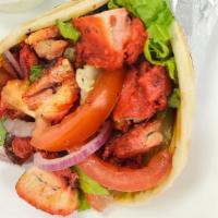 Chicken Sandwich · Chicken on pita bread with lettuce, tomatoes, onions , cucumbers and sauces.