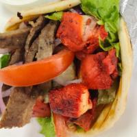 Mix Sandwich · chicken and beef gyro on pita bread with lettuce, tomatoes, onions , cucumbers and sauces.