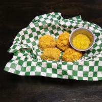 Mac & Cheese Balls · You get 4 cheese it/breaded mac and cheese balls. served with our house cheese sauce.