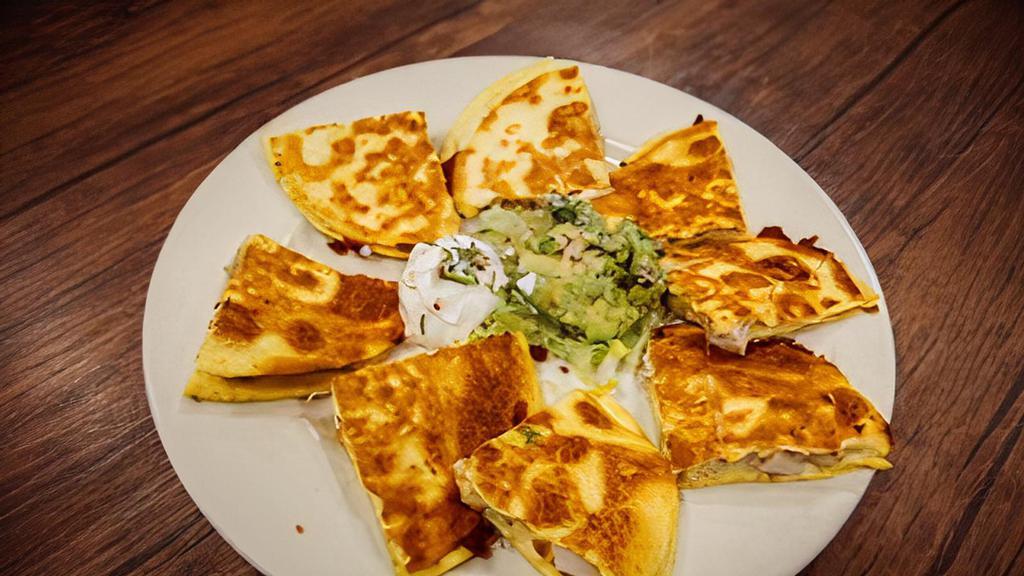 Quesadillas Especiales · Choose from Pollo a la Parrilla, Carne Asada, or Al Pastor. Served with Guacamole and Sour Cream