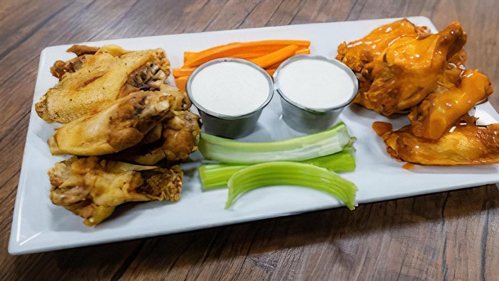 Traditional Wings 12 · Served with carrots and celery and ranch dressing. Choose sauce from Buffalo Sauce, Lemon Pepper, BBQ, Mango Habanero, Lemon Pepper-Buffalo and Flameante Buffalo Spicy