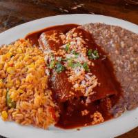 Enchiladas Rojas · Enchiladas  covered with ancho-guajillo sauce. Filled with your choice of picadillo or chees...