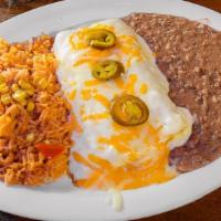 Tex-Queso Enchiladas · Enchiladas covered with chili con queso filled with your choice of jack and cheddar cheese o...