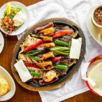 Selene'S Parrillada For Two · Fajitas Combination for two  with Grilled Shrimp, Smoked Sausage, Roasted Nopales, and Slice...
