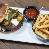 The Mexican Hamburger · Our Cheese Hamburger with Chorizo, Guacamole, Queso Fresco, and Roasted Peppers. Served with...