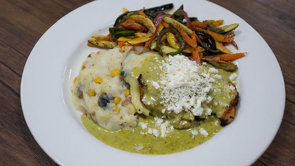 Pollo Poblano A La Parrilla · Grilled chicken breast filled with queso asadero covered with poblano cream sauce and queso fresco. Served with rice and sauteed vegetables.
