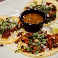 Tacos De La Calle · Served with cilantro and onions and our house made taco sauce. Your choice of Asada, Al Past...